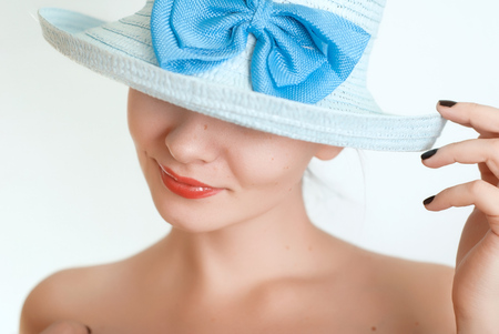 Beautiful girl in a blue hat, naked body,の写真素材