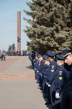 Ufa - Russia 9 may 2017 - Stella "Victory Park", a memorial and honor of the fallen heroes of the great Patriotic war to Ufa, by a line of men in uniformのeditorial素材