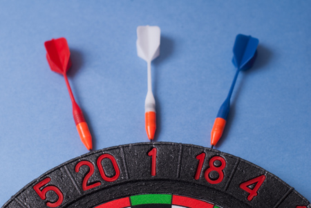 Darts and dart for throwing on a blue backgroundの写真素材