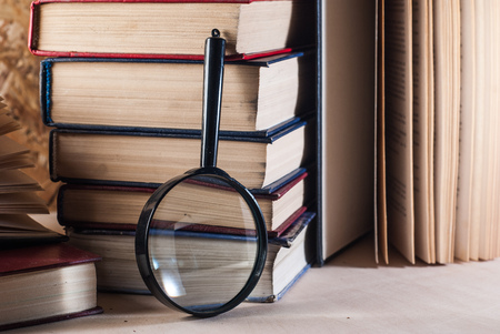 Magnifying glass and books,の写真素材