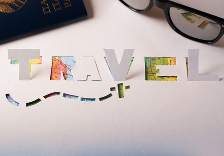 Atlas, sunglasses, American flag stencil from the paper. The concept of travel in America a Vacation in North America, world mapの写真素材