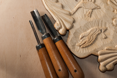 Tools for wood carving. Board with patterns.の写真素材