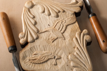 Tools for wood carving. Board with patterns.の写真素材