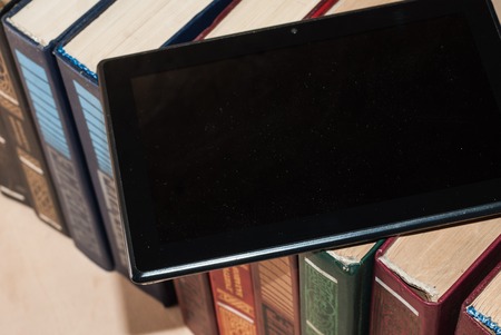 digital tablet environments the book, the concept of choice between old and newの写真素材