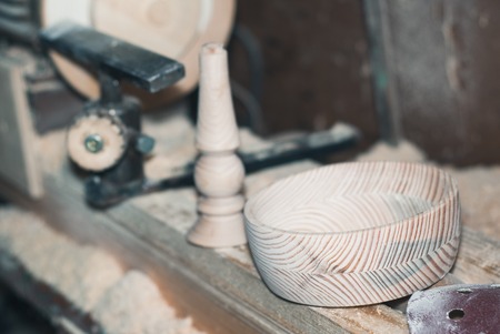 baluster and bowl of wood on the background of the lathe,の写真素材