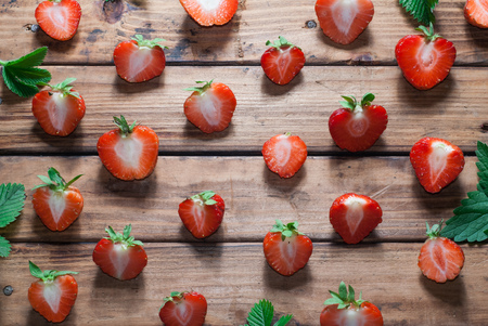 strawberry template on wooden background, rustic style, red berry and foliageの写真素材