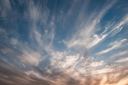 Dramatic sky at sunset, the contrast of Cirrus cloud shapes, cloud abstract landscapeの写真素材