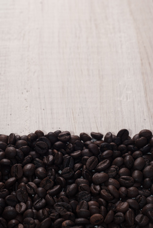 Coffee beans on wood backgroundの写真素材