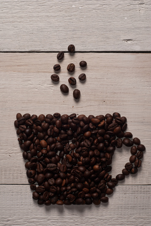 Cup of coffee made from beans. on wooden background ,rustic styleの写真素材