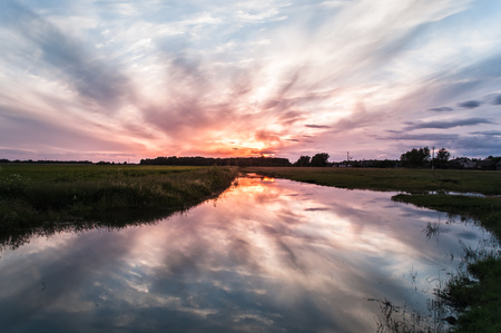 bright colorful sunset, sunlight, clouds, epic, dramatic landscapeの写真素材