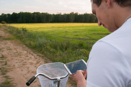 Cyclist using Navigator on your smartphone,の写真素材