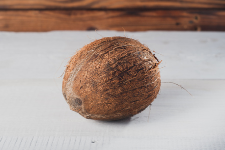 Coconut on old wood background, white woodの写真素材