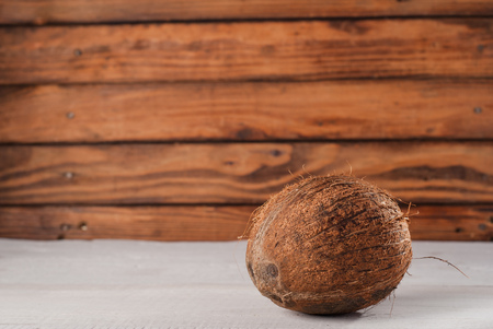 Coconut on old wood background, white woodの写真素材