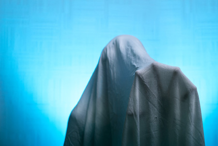 Spooky Ghost in the sheet held out his hand. happy Halloween holidayの写真素材