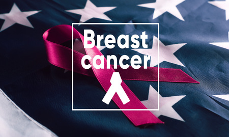 Banner breast Cancer. pink ribbon symbol on American flag backgroundの写真素材