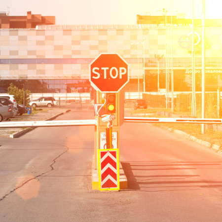 Stop sign and barrier at the entry to the territory, check point