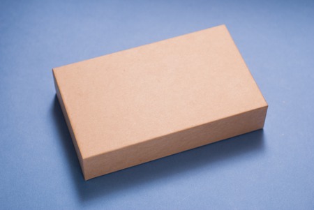 Box on blue background, close-up, mockup packagingの写真素材