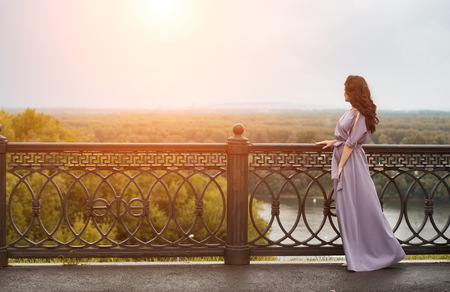 woman in autumn Park, girl in a dress, light effect, autumn landscapeの写真素材