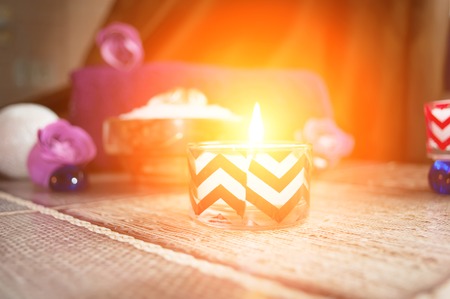 Candles and stones on a worn wooden background, copy space, Spa backgroundの写真素材