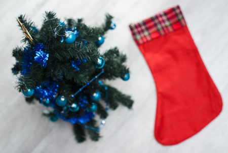 Christmas boot stocking and Christmas tree with ballsの写真素材