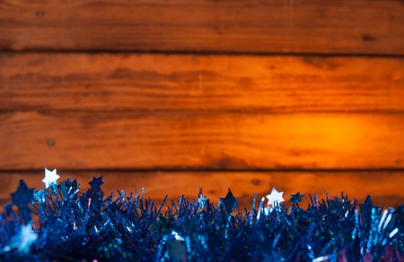 With Christmas on the old wooden background and blue tinsel garlands, yellow backgroundの写真素材