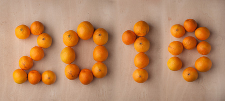 The new year 2018, the tangerines on wooden backgroundの写真素材