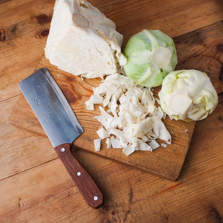 cabbage and knife on a cutting Board, fresh vegetable, diet food vegetarian, top viewの写真素材