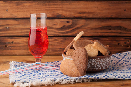 cherry juice. cookies chocolate and vanilla. wooden background in rustic styleの写真素材