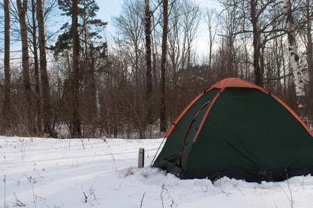 Tent in the snow, camping in winter, travel on winter vacationの写真素材