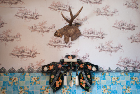 Trophy on the wall in the house, home kitchen interior, wooden utensils setの写真素材