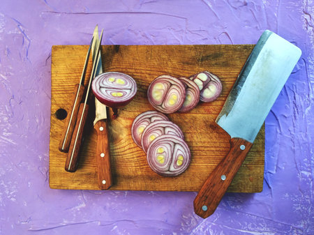 Onion is whole and sliced. Chopped onions on a cutting Board. Knives with a wooden handle. Cooking...
