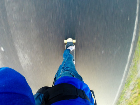 go on longboard on the asphalt,