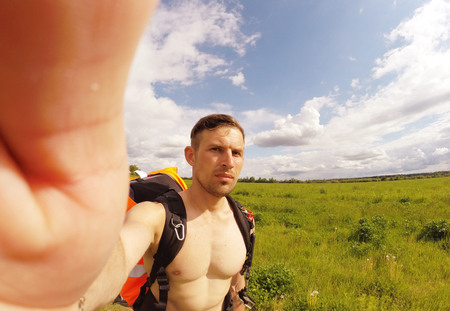 Travel selfie, guy traveling in nature on a hot day,の写真素材