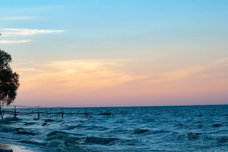 Sunset on the shore, romantic landscape, old wooden pier,の写真素材