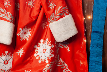 Santa outfit, red fur coat with snowflake, Christmas background