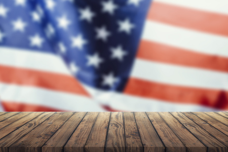 Us flag on a wooden old table. Concept of the 4th of July celebrationの写真素材