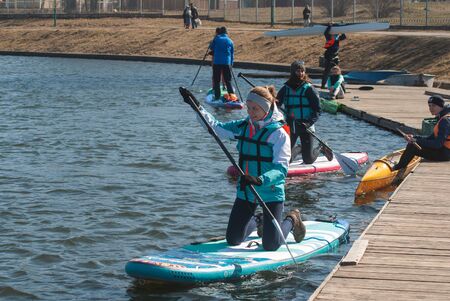 Minsk, Belarus - March 30: a team of office workers takes part in the race for the paddle Board, the opening of the season,のeditorial素材
