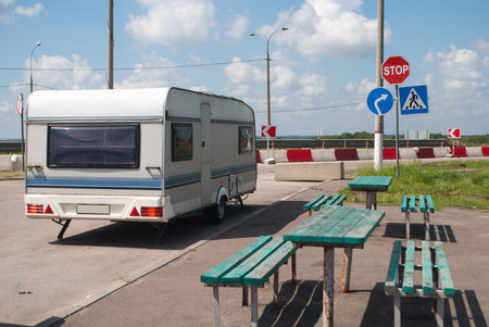 Motorhome on wheels parked at the camping site, road trip