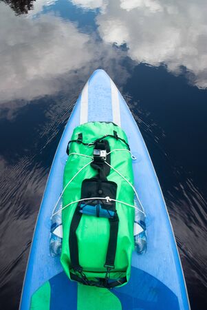 paddle Board close-up, reflection of the sky in the water,の写真素材