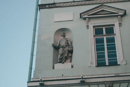 The facade of the building with ancient sculpture. Ancient Greek style in architecture,の写真素材