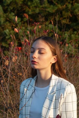 Young beautiful girl in autumn Park, autumn background,の写真素材
