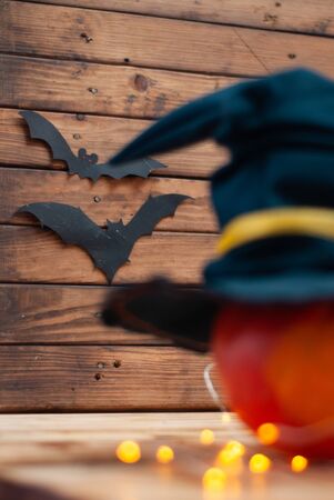 Halloween pumpkin with hat and yellow garlandの写真素材