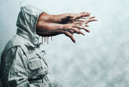 zombie hands stick out of the hood. terrible nightmare. Halloween backgroundの写真素材