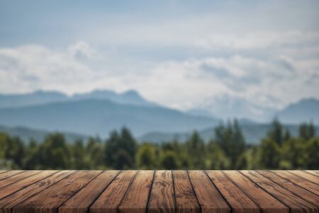 wooden table for advertising with the Alpine mountains in the background,の写真素材