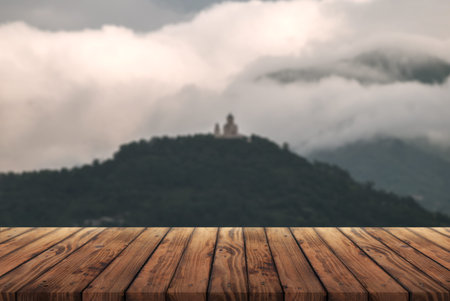Wooden table for advertising products on the background of an ancient temple on the mountain,の写真素材
