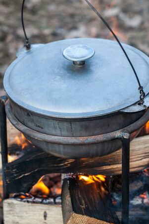 pot on fire close-up, cooking on an open fire during a hike,の写真素材