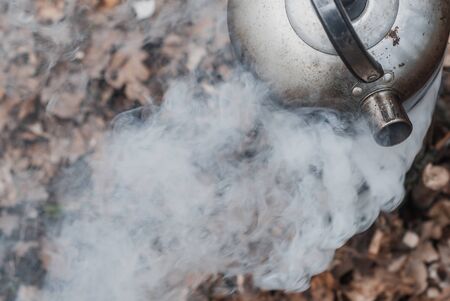 Old teapot in smoke close-up,の写真素材