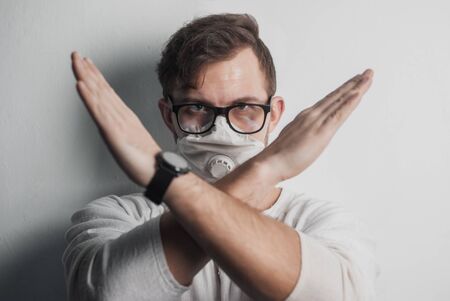 Doctor with glasses portrait, stopping the gesture with his handsの写真素材