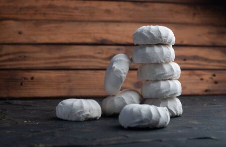 white marshmallow on a wooden background, advertising marshmallowsの写真素材