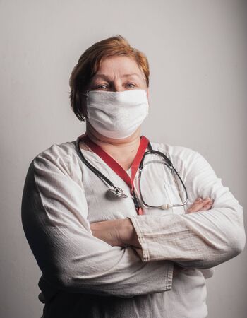 A cheerful doctor is proud of the work done, a hero doctor protects against coronavirus,の写真素材